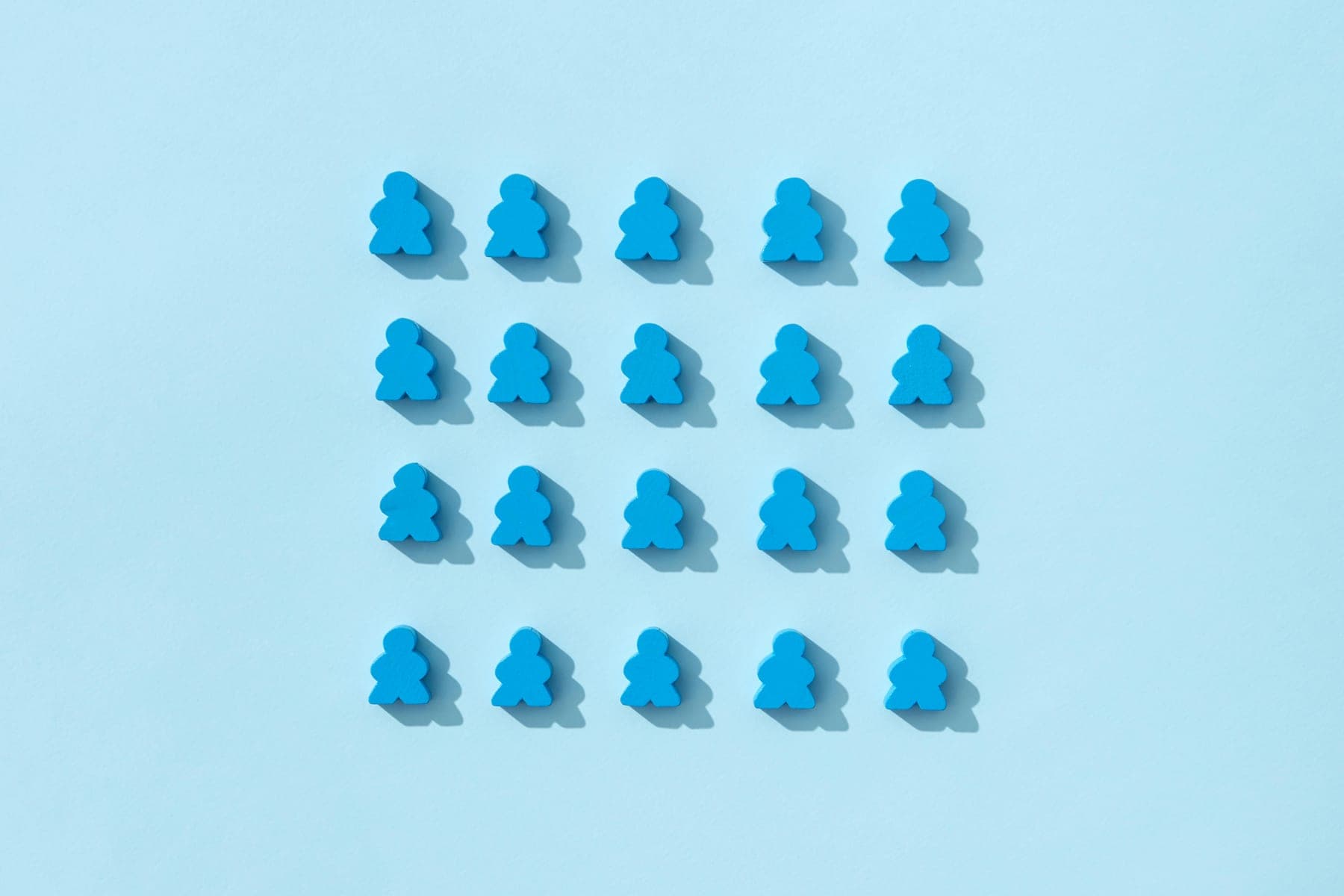 Rows of identical blue figures โ everyone moving in the same direction
